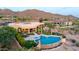 Estate exterior with a private pool, spa, lounge area, covered patio, and desert views at 4328 N Pinnacle Ridge Cir, Mesa, AZ 85207