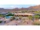 Estate exterior view with pool, spa, desert landscaping and mountains in the distance at 4328 N Pinnacle Ridge Cir, Mesa, AZ 85207
