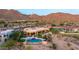 Estate exterior with a private pool, spa, lounge area, covered patio, and desert landscaping and views at 4328 N Pinnacle Ridge Cir, Mesa, AZ 85207