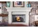 Cozy fireplace with a decorative mantel and stone surround creates a warm focal point in the living space at 4328 N Pinnacle Ridge Cir, Mesa, AZ 85207