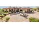 Beautiful home featuring professional landscaping, stone accents, fountain and paver driveway at 4328 N Pinnacle Ridge Cir, Mesa, AZ 85207