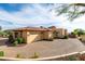 Spacious three-car garage with a paver driveway, stone accents and professional landscaping at 4328 N Pinnacle Ridge Cir, Mesa, AZ 85207