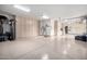 Well-lit oversized garage featuring abundant cabinet space, a clean epoxy floor, and ample room for parking and storage at 4328 N Pinnacle Ridge Cir, Mesa, AZ 85207