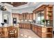 Gourmet kitchen with stainless steel appliances, custom cabinetry, and granite counters at 4328 N Pinnacle Ridge Cir, Mesa, AZ 85207
