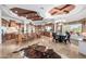 Open kitchen and breakfast nook features a large island, wood cabinets, and a lovely chandelier at 4328 N Pinnacle Ridge Cir, Mesa, AZ 85207