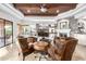 Warm living room featuring stone fireplace, wood ceiling, comfortable leather seating and mounted flatscreen TV at 4328 N Pinnacle Ridge Cir, Mesa, AZ 85207