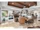 Bright living room has stone fireplace, flatscreen tv, wood ceiling, and comfortable seating area at 4328 N Pinnacle Ridge Cir, Mesa, AZ 85207