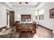 Comfortable main bedroom featuring a wooden bed frame, hardwood floors, and a window with natural light at 4328 N Pinnacle Ridge Cir, Mesa, AZ 85207
