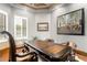Office featuring wood floors, decorative ceiling, and large desk under wall art at 4328 N Pinnacle Ridge Cir, Mesa, AZ 85207
