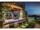 Outdoor bar area with seating, stone columns, and covered ceiling with desert views at 4328 N Pinnacle Ridge Cir, Mesa, AZ 85207