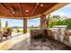 Featuring an outdoor kitchen, a grill, stainless steel appliances, and desert views at 4328 N Pinnacle Ridge Cir, Mesa, AZ 85207