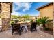 A cozy outdoor seating area with comfortable furniture and lush landscaping, perfect for relaxing at 4328 N Pinnacle Ridge Cir, Mesa, AZ 85207