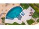 Aerial shot of the backyard pool featuring a spa, integrated fountains, lounge seating, and desert landscaping at 4328 N Pinnacle Ridge Cir, Mesa, AZ 85207