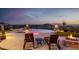 Outdoor patio with lounge chairs overlooking pool, spa, fire pits, and scenic views at 4328 N Pinnacle Ridge Cir, Mesa, AZ 85207