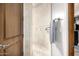 Walk-in shower with marble tile, mosaic accent wall, and chrome fixtures at 4328 N Pinnacle Ridge Cir, Mesa, AZ 85207