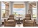 Cozy seating area with scenic views, perfect for relaxing and enjoying the natural light in the room at 4328 N Pinnacle Ridge Cir, Mesa, AZ 85207