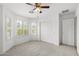 Spacious bedroom with plantation shutters, closet, and neutral carpeting at 4404 W Ellis St, Laveen, AZ 85339