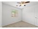 Bright bedroom with a ceiling fan and a window offering natural light at 4404 W Ellis St, Laveen, AZ 85339