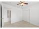 Light-filled bedroom with a ceiling fan and closet, offering a comfortable space at 4404 W Ellis St, Laveen, AZ 85339