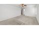 Spacious bedroom with neutral walls, plush carpet, and a ceiling fan at 4404 W Ellis St, Laveen, AZ 85339