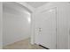 Welcoming entryway featuring a white front door, tiled flooring, and neutral walls at 4404 W Ellis St, Laveen, AZ 85339