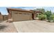 Beautiful home with a two-car garage, well-maintained landscaping, and a spacious driveway at 4404 W Ellis St, Laveen, AZ 85339
