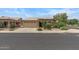 Attractive single-Gathering home featuring a two-car garage, tile roof, and mature landscaping at 4404 W Ellis St, Laveen, AZ 85339