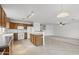 Open-concept kitchen featuring an island, white appliances, and ample cabinet space at 4404 W Ellis St, Laveen, AZ 85339
