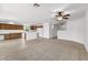 This bright living room features neutral carpet and tile flooring with seamless kitchen and hallway access at 4404 W Ellis St, Laveen, AZ 85339