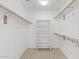 Walk-in closet with shelving and hanging rods for maximum storage at 4404 W Ellis St, Laveen, AZ 85339
