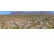 Aerial view of homes in a desert community nestled in the mountains at 4562 S Alamos Way, Gold Canyon, AZ 85118