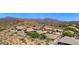Beautiful aerial view of houses with well-maintained landscaping and mountain views at 4562 S Alamos Way, Gold Canyon, AZ 85118