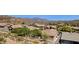 An aerial view of desert homes showing lush trees and the surrounding arid landscape at 4562 S Alamos Way, Gold Canyon, AZ 85118