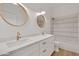 Bathroom featuring double sinks, gold hardware, and marble counters with tile surround at 4562 S Alamos Way, Gold Canyon, AZ 85118