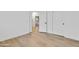 This light bedroom has wood floors and a sliding closet door, with another room adjacent at 4562 S Alamos Way, Gold Canyon, AZ 85118