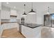 Modern kitchen features white cabinets, stone countertops, and stainless steel appliances at 4562 S Alamos Way, Gold Canyon, AZ 85118