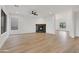 Bright living room showcases a black tiled fireplace, recessed lighting, and wood floors at 4562 S Alamos Way, Gold Canyon, AZ 85118