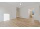 The spacious main bedroom showcases wood floors and neutral walls, leading to the ensuite bath at 4562 S Alamos Way, Gold Canyon, AZ 85118