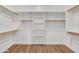 Walk-in closet with wooden rails and center shelving provides generous storage space at 4562 S Alamos Way, Gold Canyon, AZ 85118