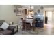 Cozy dining area with a table set for four next to the open kitchen at 4718 W Sanna St, Glendale, AZ 85302