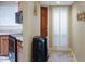 Inviting entryway with tile flooring, shuttered window, and paneled door at 4718 W Sanna St, Glendale, AZ 85302