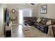 Comfortable living room with large TV, modern furniture, and tiled flooring at 4718 W Sanna St, Glendale, AZ 85302