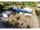 Overhead of sprawling estate featuring tennis courts, circular drive, and lush landscaping at 4801 E Horseshoe Rd, Paradise Valley, AZ 85253
