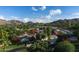 Expansive property with main house, guesthouse, and multiple car garages in a lush landscape at 4801 E Horseshoe Rd, Paradise Valley, AZ 85253