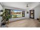 Bright room with scenic backyard and pool views through a large black-framed window, adding a touch of nature indoors at 4801 E Horseshoe Rd, Paradise Valley, AZ 85253