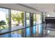 Large empty room featuring sliding glass doors that opens up to the outside patio and landscape at 4801 E Horseshoe Rd, Paradise Valley, AZ 85253