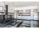 Spacious garage with a car lift, and built-in cabinets, providing ample storage and workspace at 4801 E Horseshoe Rd, Paradise Valley, AZ 85253