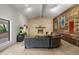 Cozy living room featuring a stone fireplace and a comfortable sectional sofa at 4801 E Horseshoe Rd, Paradise Valley, AZ 85253