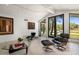 Bright living room with tile floors, modern furniture, and large windows overlooking the yard at 4801 E Horseshoe Rd, Paradise Valley, AZ 85253