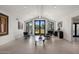 Bright living room with tile floors, modern furniture, and large windows overlooking the yard at 4801 E Horseshoe Rd, Paradise Valley, AZ 85253
